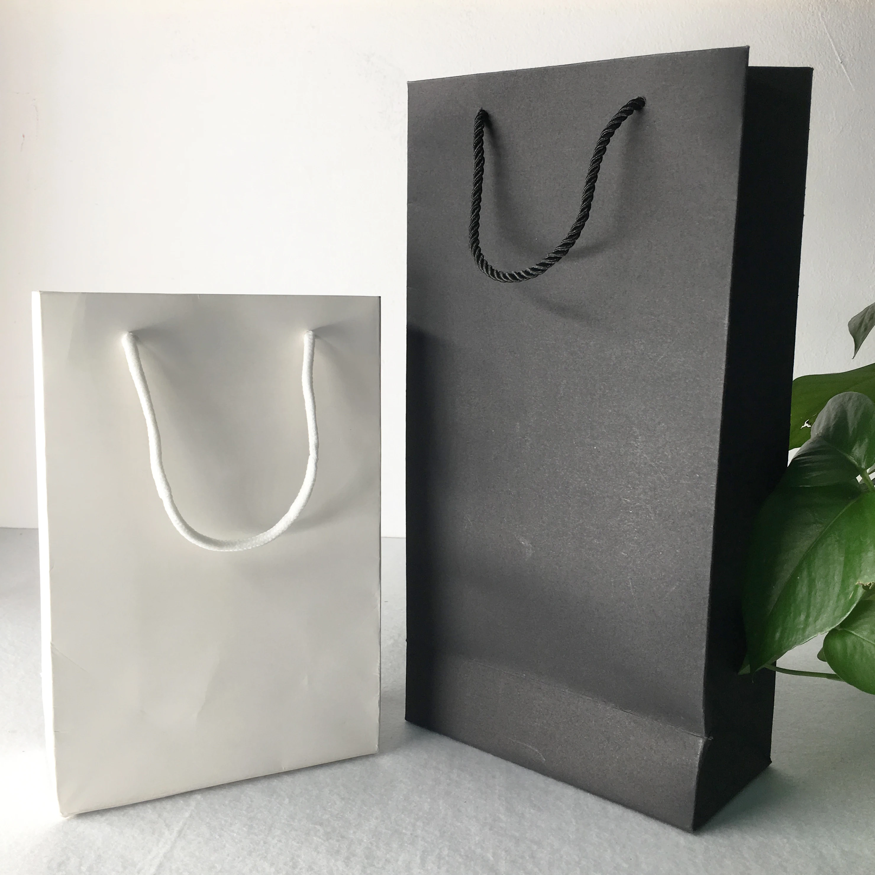 custom vertical type black/white cardboard paper bag with cotton rope