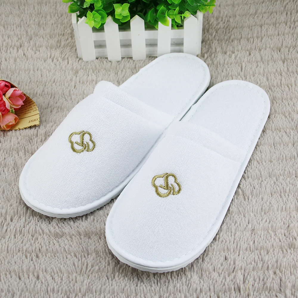 
white terry disposable hotel bathroom slippers 