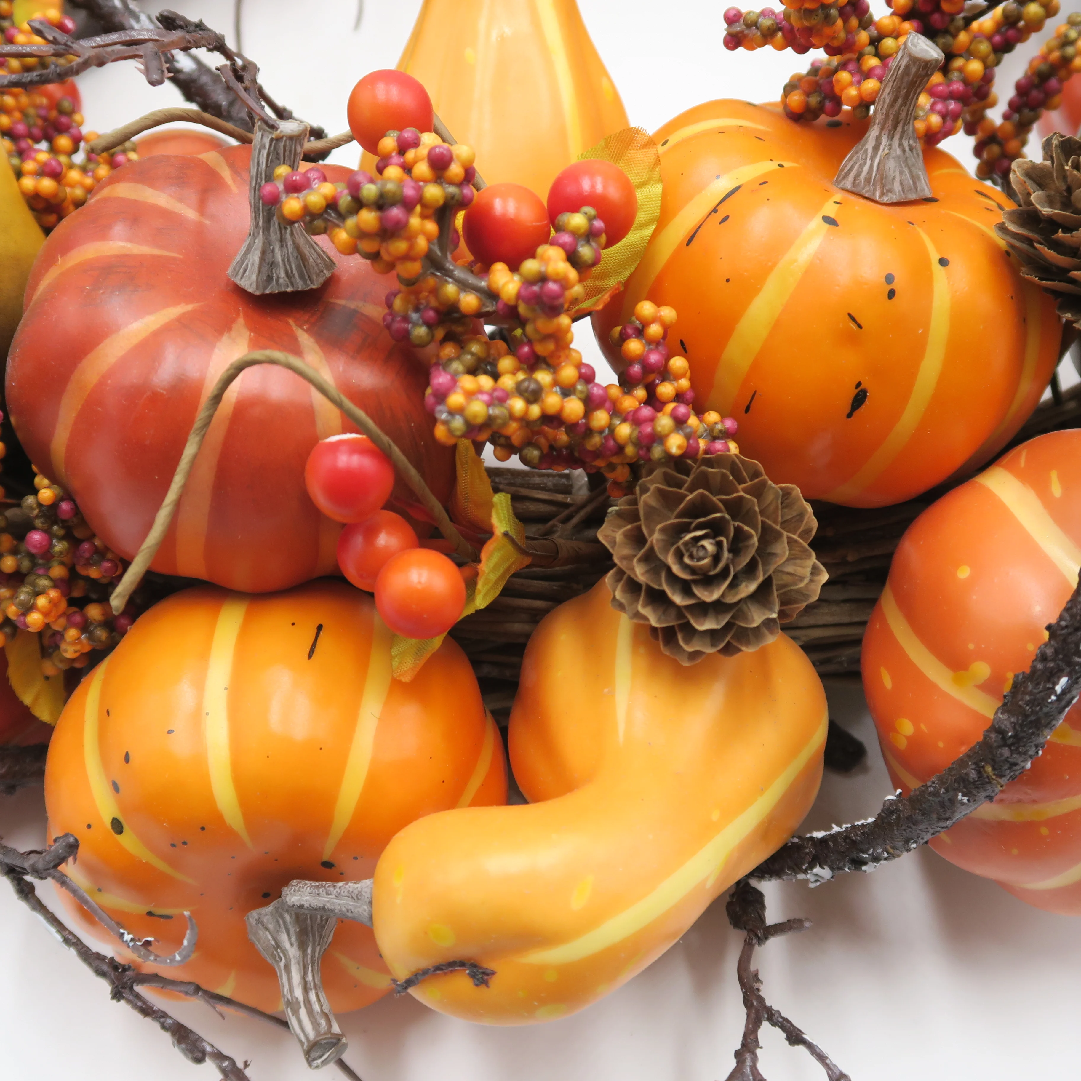 Fall autumn golden pumpkin wreath with berry for harvest and door decoration