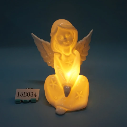 White porcelain angle figurine with light