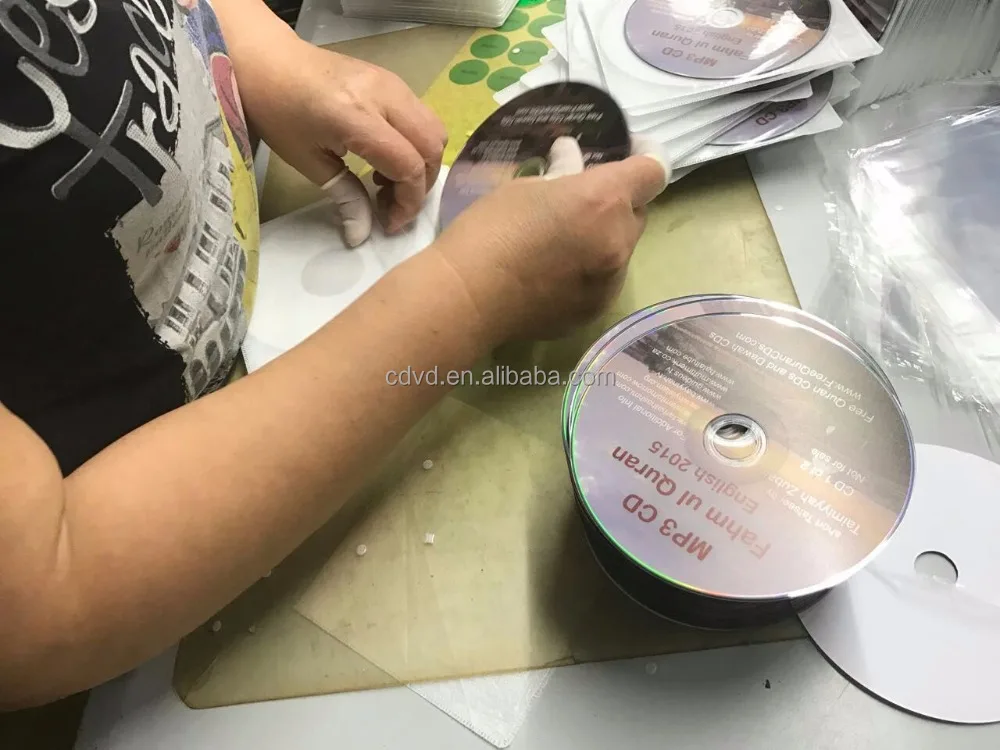 CD in CD paper sleeve with a cellophane window and a flap and an adhesive backing and adhesive seal packaging services
