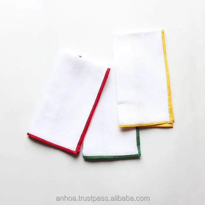 White linen dinner napkin with red/ green/ yellow color border