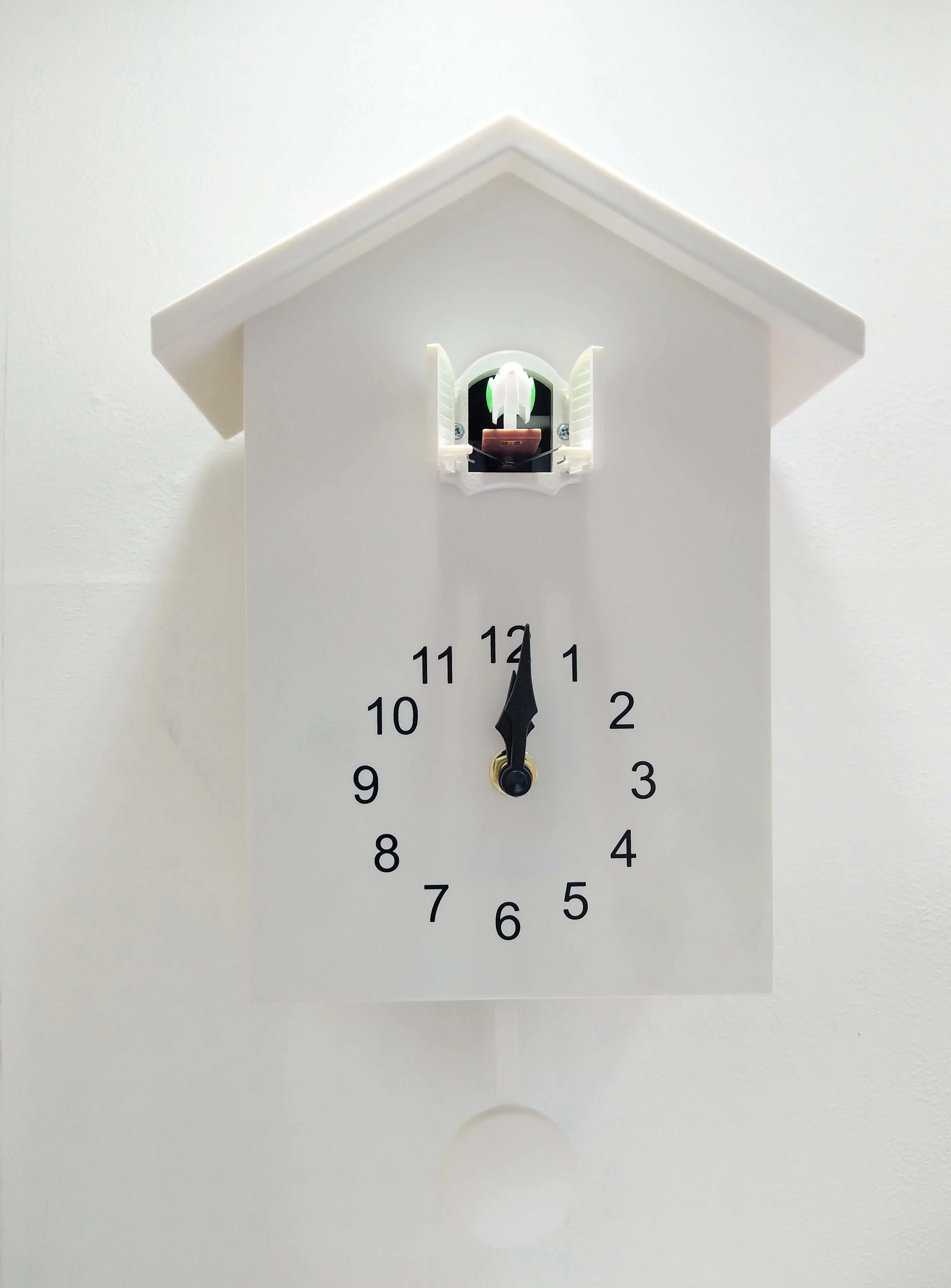 Plastic cuckoo clock with bird sound music