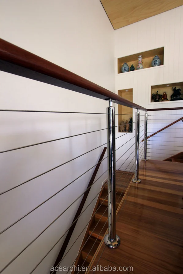 Vertical deck cable railing system with Round Stainless steel posts and Handrail