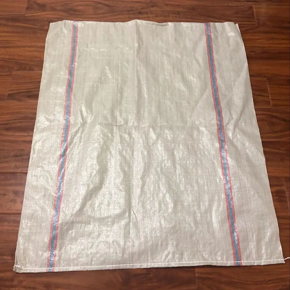 large green plastic woven sack for garbage, construction debris