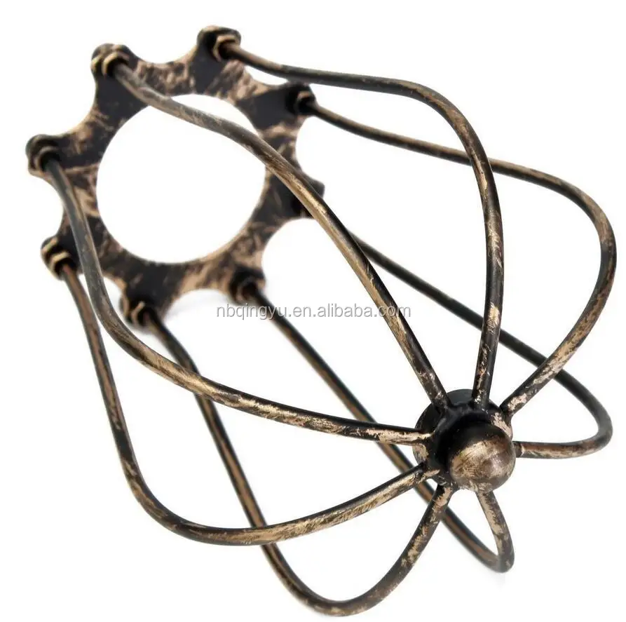 Industrial style metal cage beside lamp cast iron lampshade