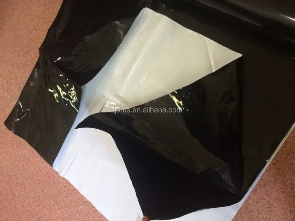 Plastic white and black ground cover poly cover