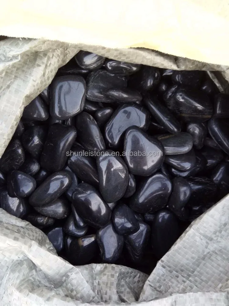 
polished black river pebble stone with wax 
