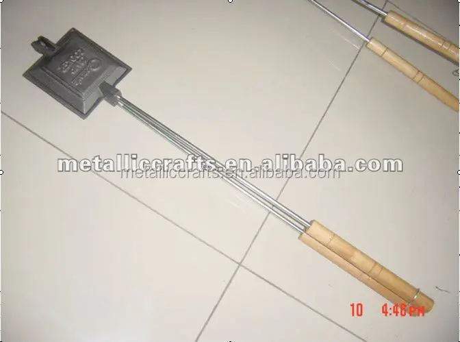 
heavy cast iron fireside pie iron with stay-cool wooden handles 