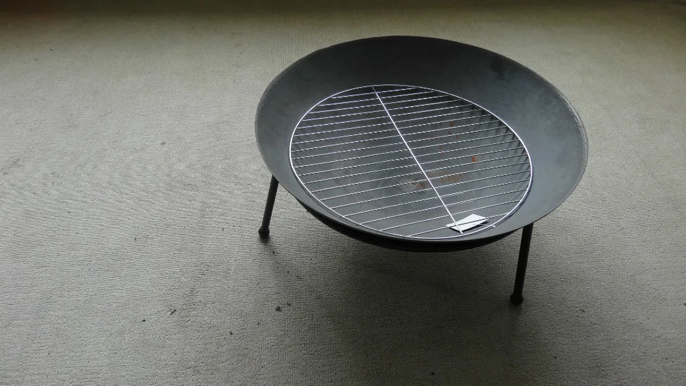 
outdoor cast iron fire pit/bowl with wood grill 