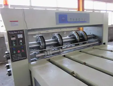 Rotary separately cutting creasing slotting machine for corrugated carton