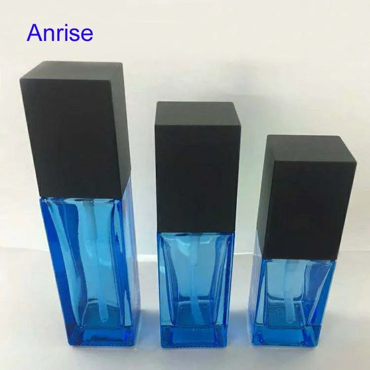 Distinctuve 30ml 50ml Square Clear Glass Cosmetic Essence Bottle Refillable Serum Squeeze Spray Bottle with Black Cube Cap