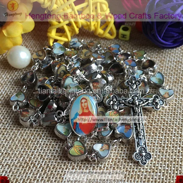 mix catholic figures on alloy heart rosary which is mixed with saint icon and virgin mary centerpiece