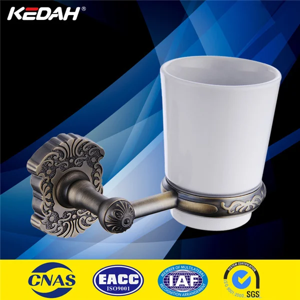 
antique bronze ceramic and glass toothbrush cup 