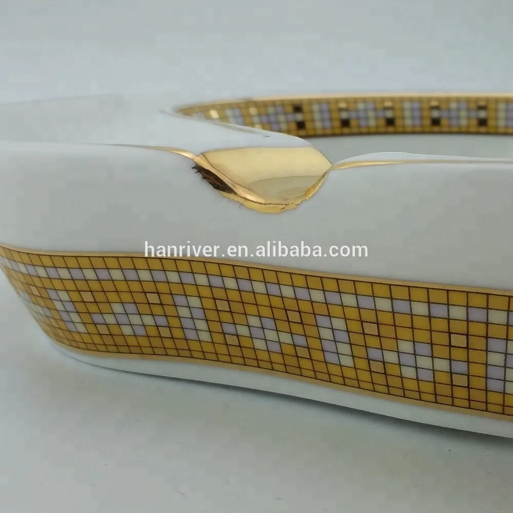 
Best selling oval ceramic ashtray with golden edge with two golden rest with customized logo for sale 