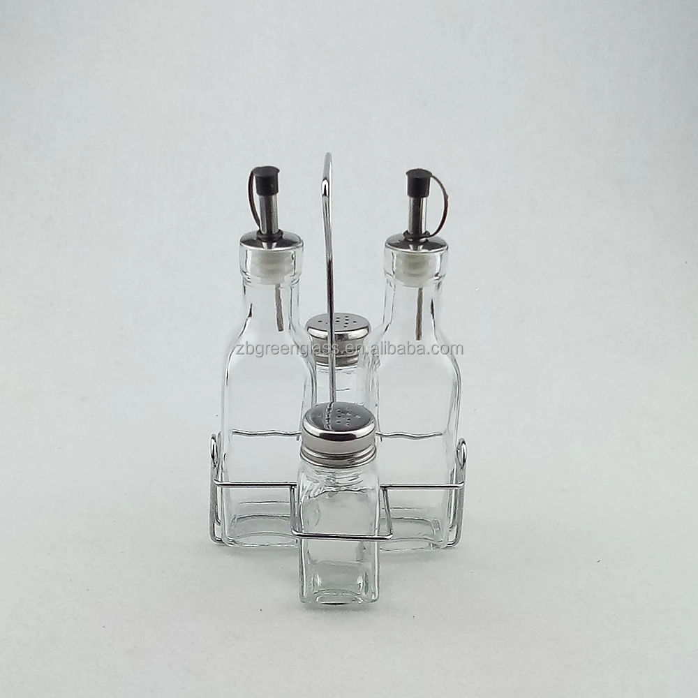 Clear glass salt pepper shakers and oil vinegar bottles