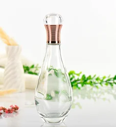 High end free sample 60ml 100ml 150ml bowling ball shape glass lotion bottle with gold pump for body face lotion