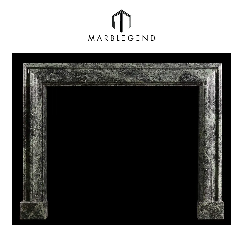 
a queen anne style bolection dark green marble fireplace 