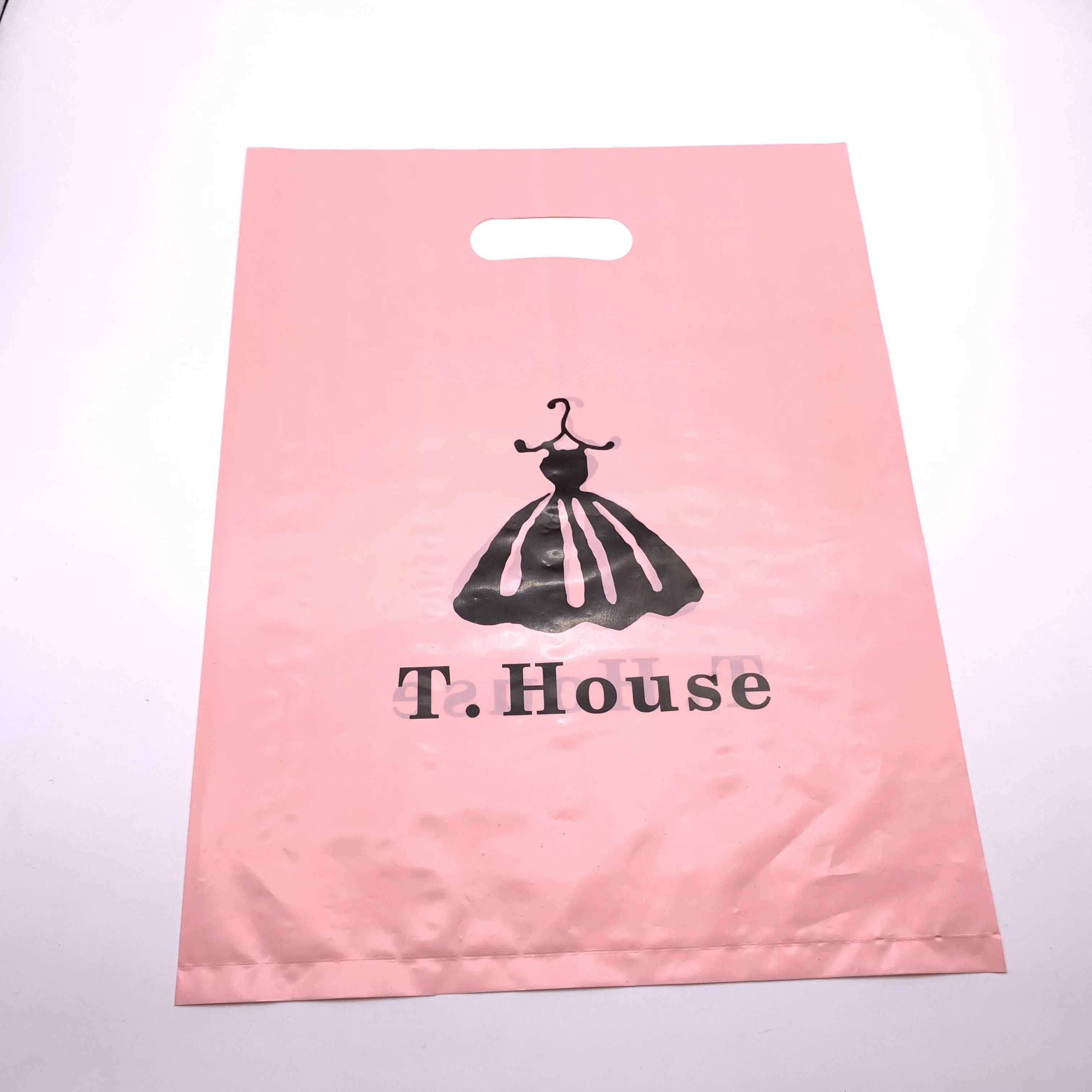 Custom made handle die cut plastic bags