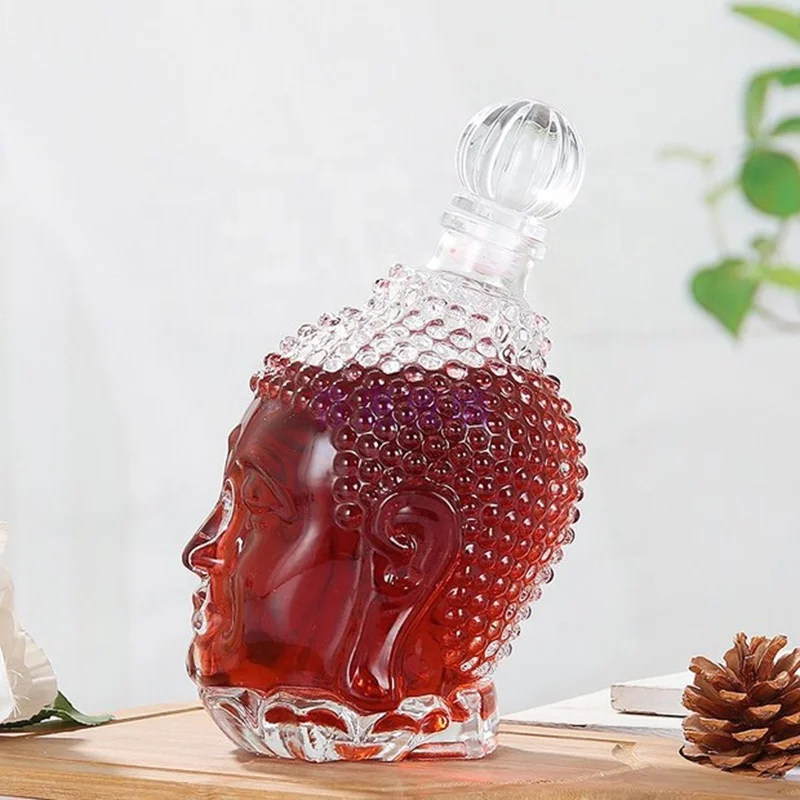 
China Wholesale Factory Price 750ml Buddha Head Shape Glass Wine Bottles 