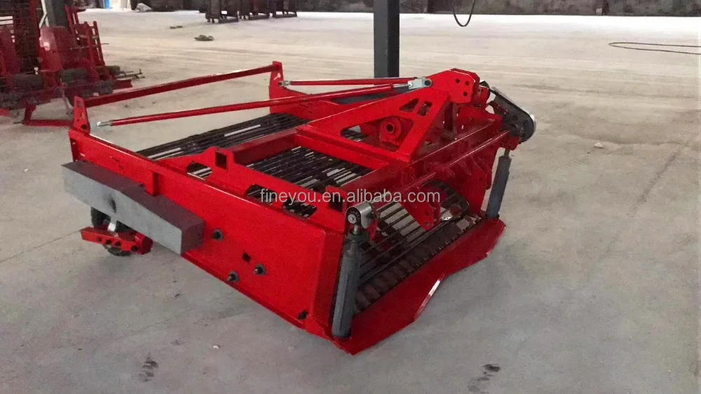 
Tractor supporting peanut harvester 