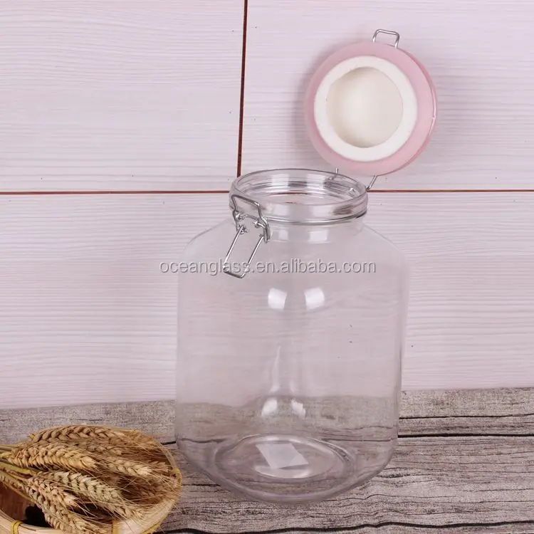 footed square glass jar fancy mason glass jar/mason honey jar with ceramic clamp lid