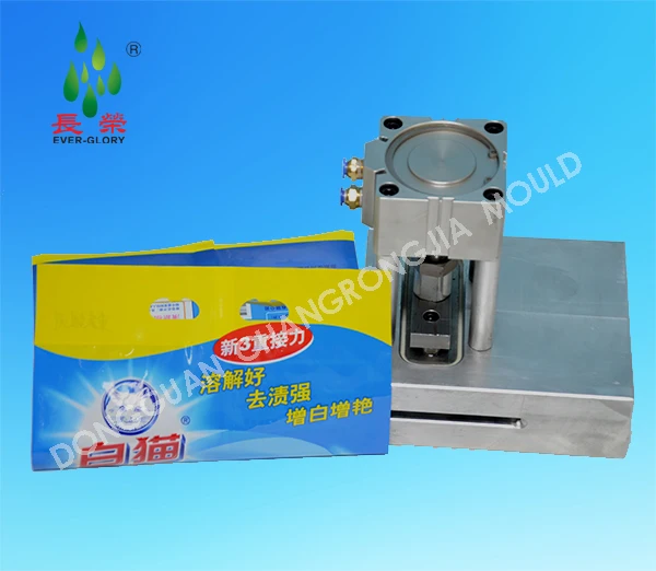 
Дырокол с двумя отверстиями для стирального порошка 