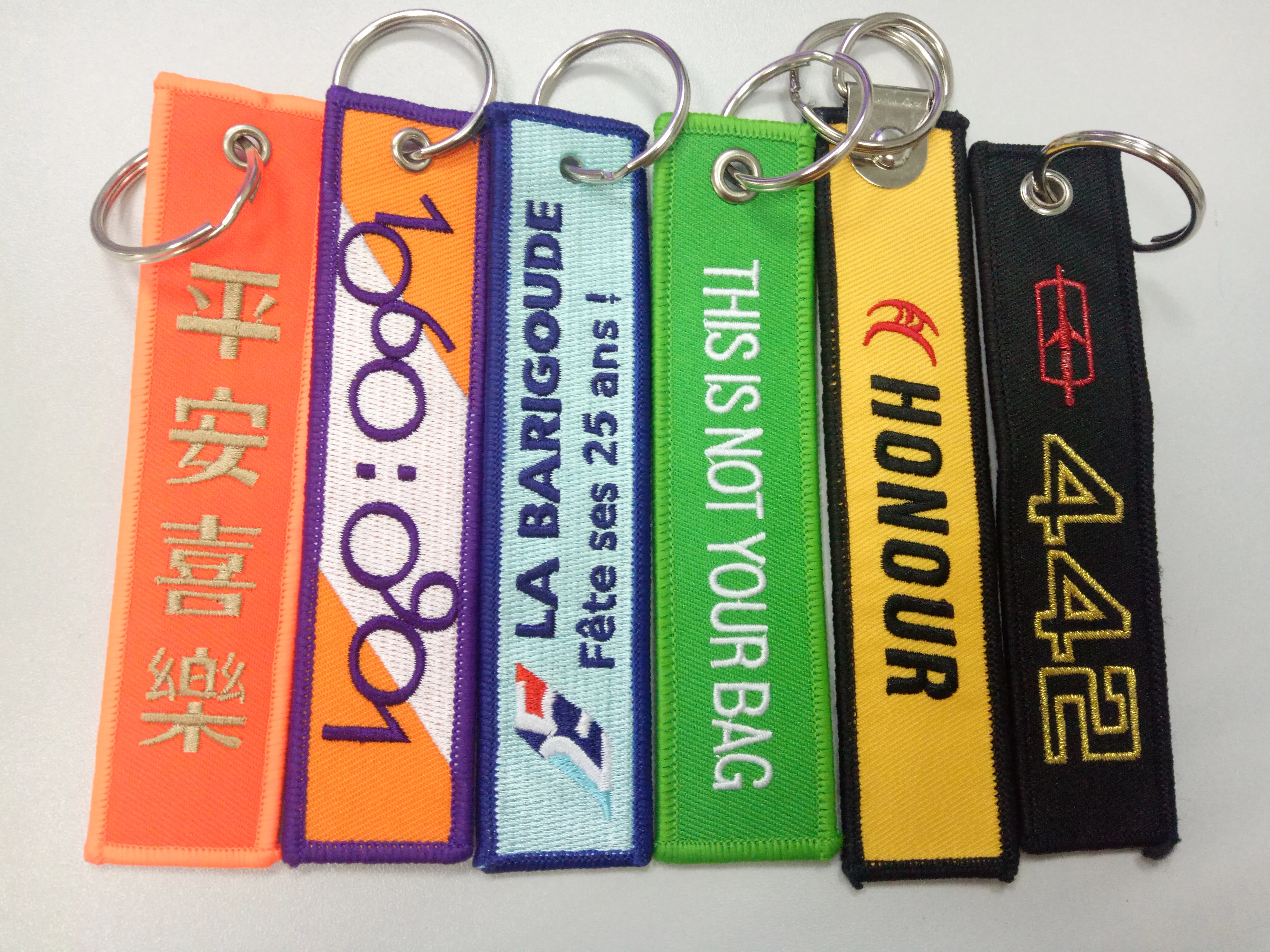 China factory direct custom Flight embroidery keychain woven key tag with your own logo