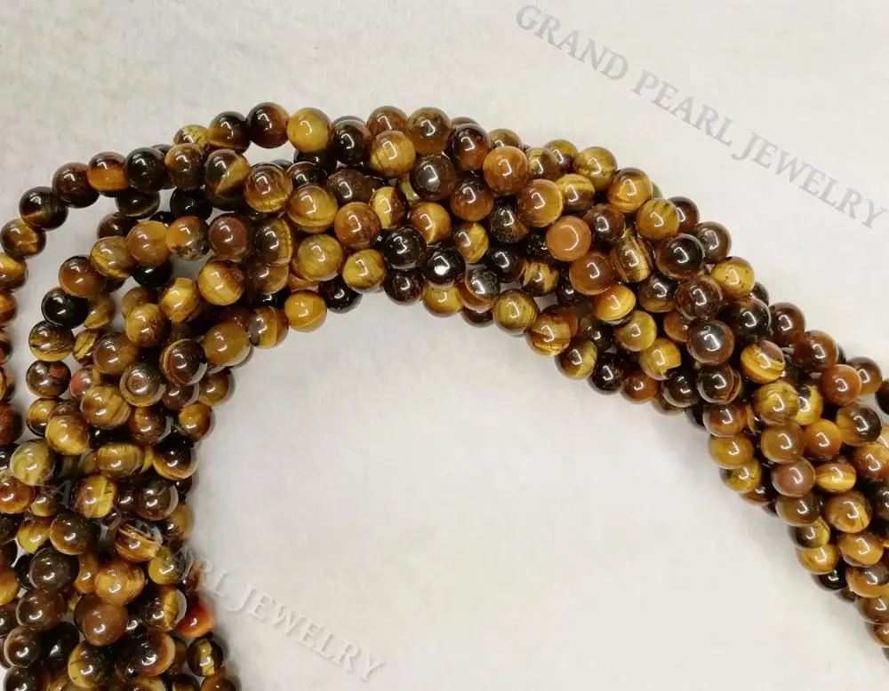 
Yellow / Brown Tigereye round beads in 16