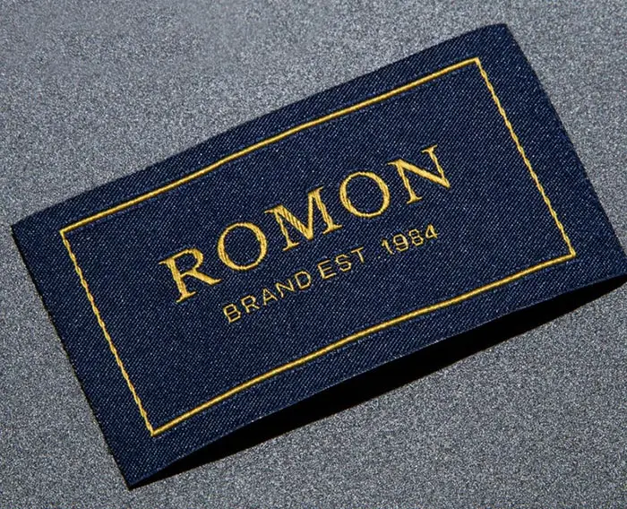 High density gold thread woven label with fold