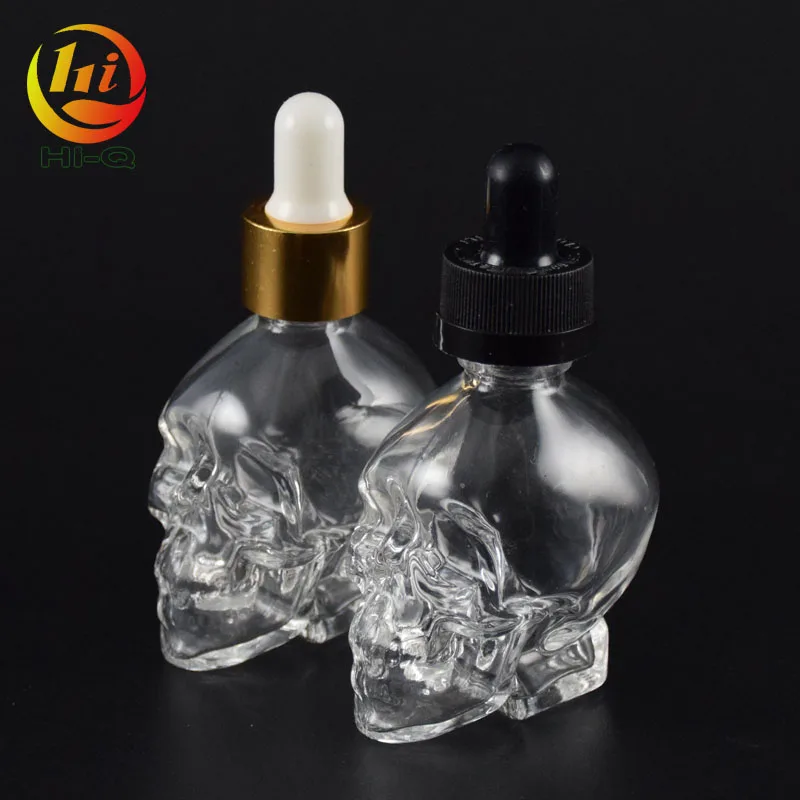 unique shape glass liquid bottle 15ml 30ml 50ml clear skull glass dropper bottle