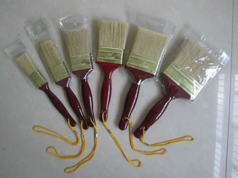 Paint brush with wooden handle