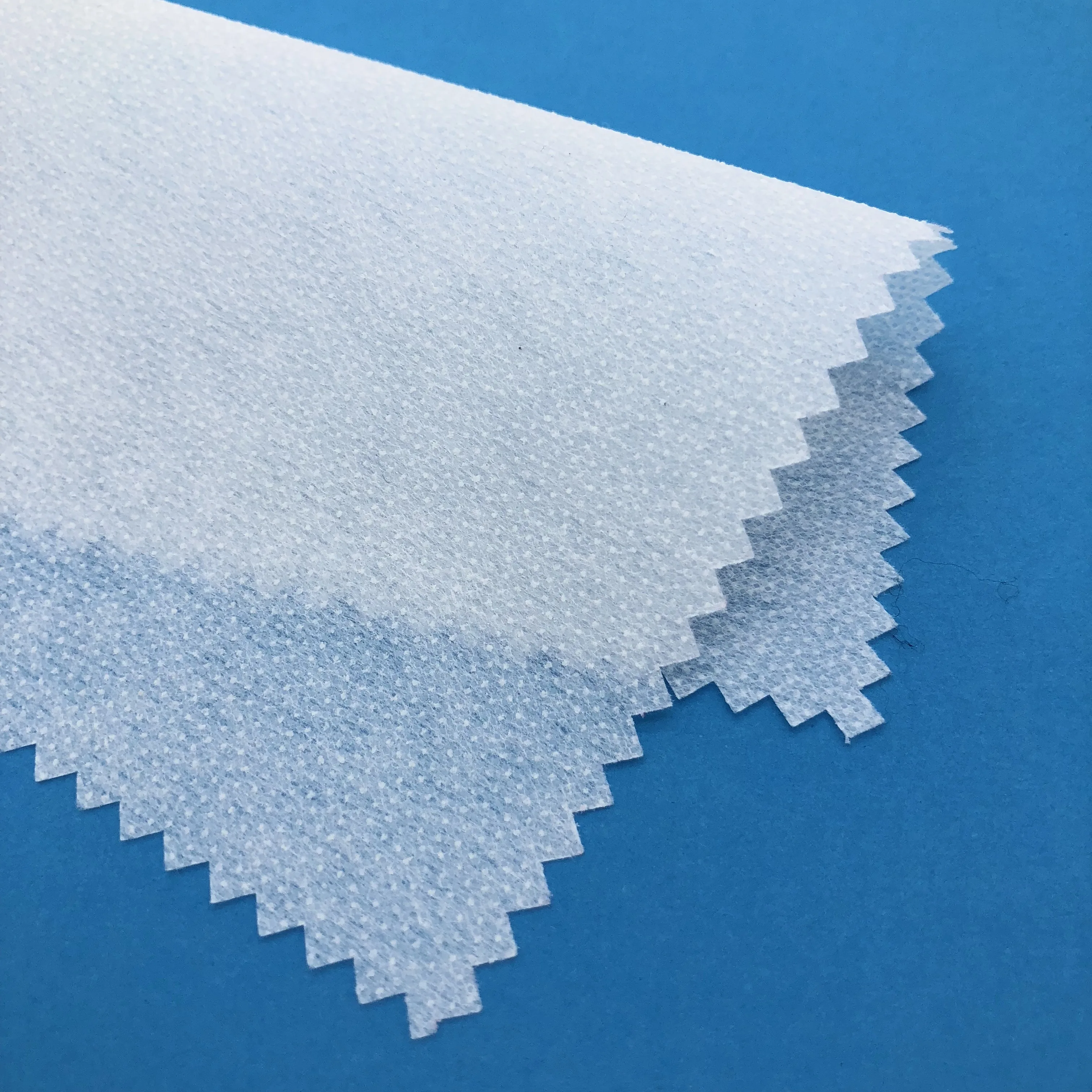 
100 polyester nonwoven fusible hot rolling interlining for apparel 