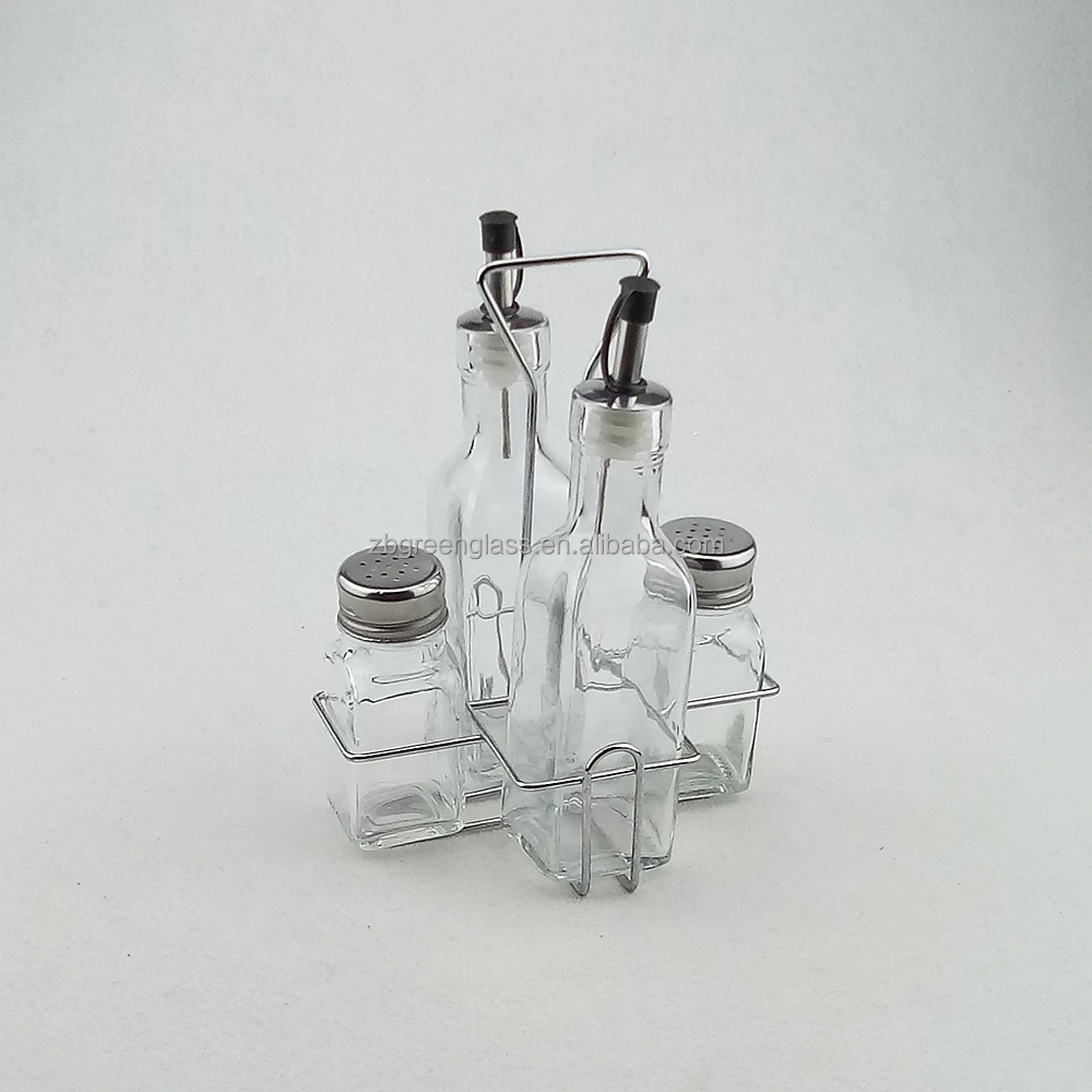 Clear glass salt pepper shakers and oil vinegar bottles