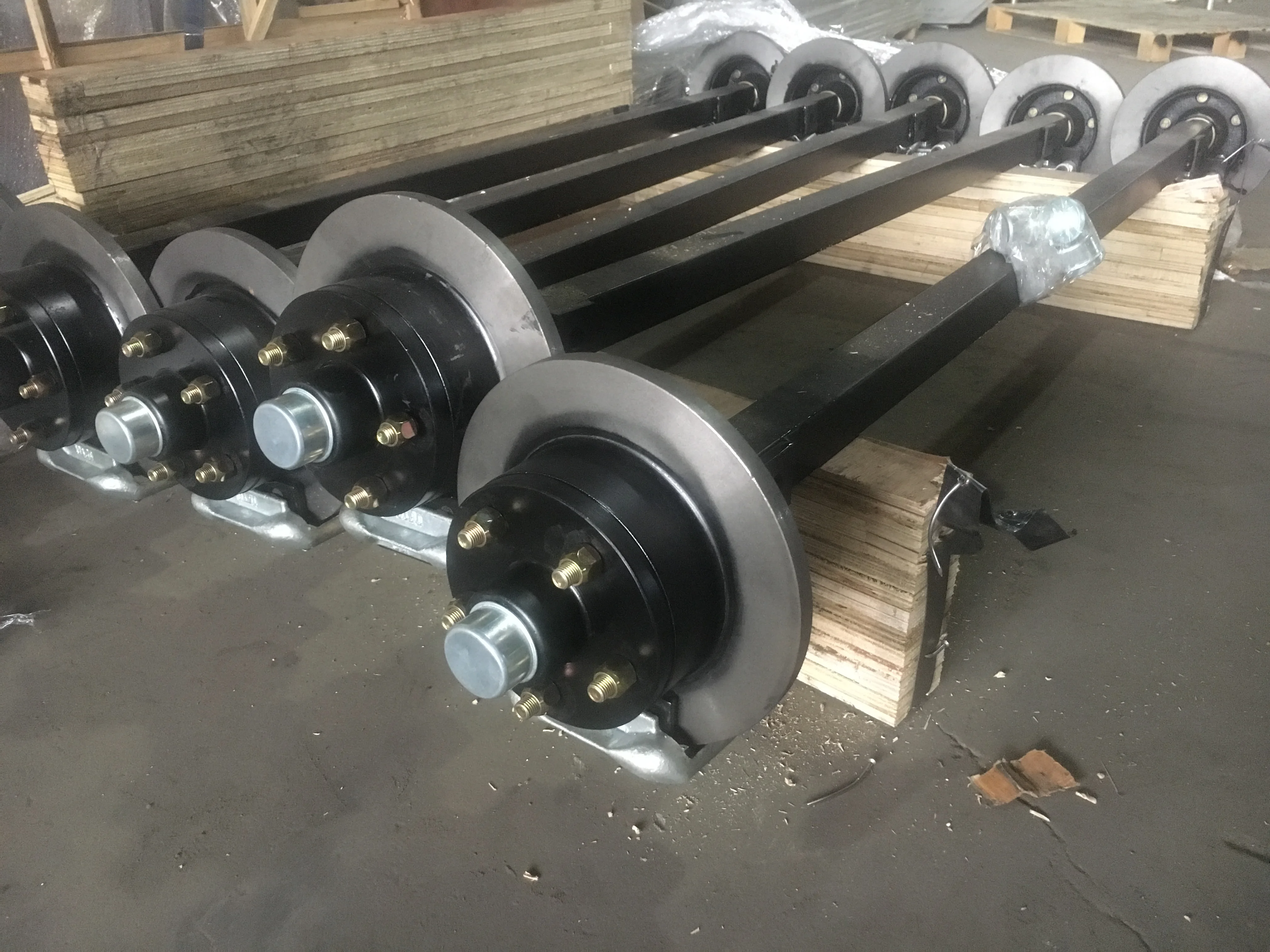 Axle for trailers with hand breaker