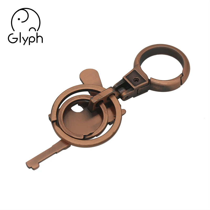 Wholesale 3d bronze fancy gun shaped keychain handmade craft keyring for promotional gift