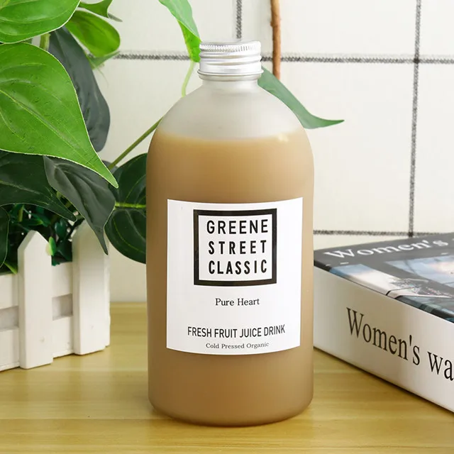 new design wholesale price available different sizes frosted and clear glass juice bottle
