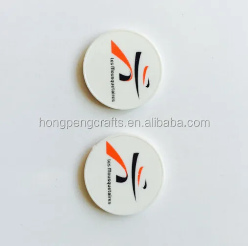 
Colored embossed plastic token/coin 