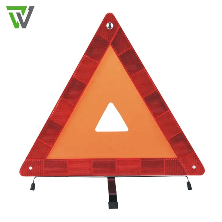 Red dot safety car triangle road sign / Vehicle warning triangle in car