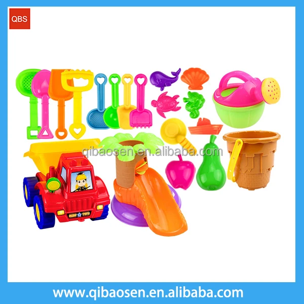 Plastic summer toy sand shovel car and sand mould beach toy .