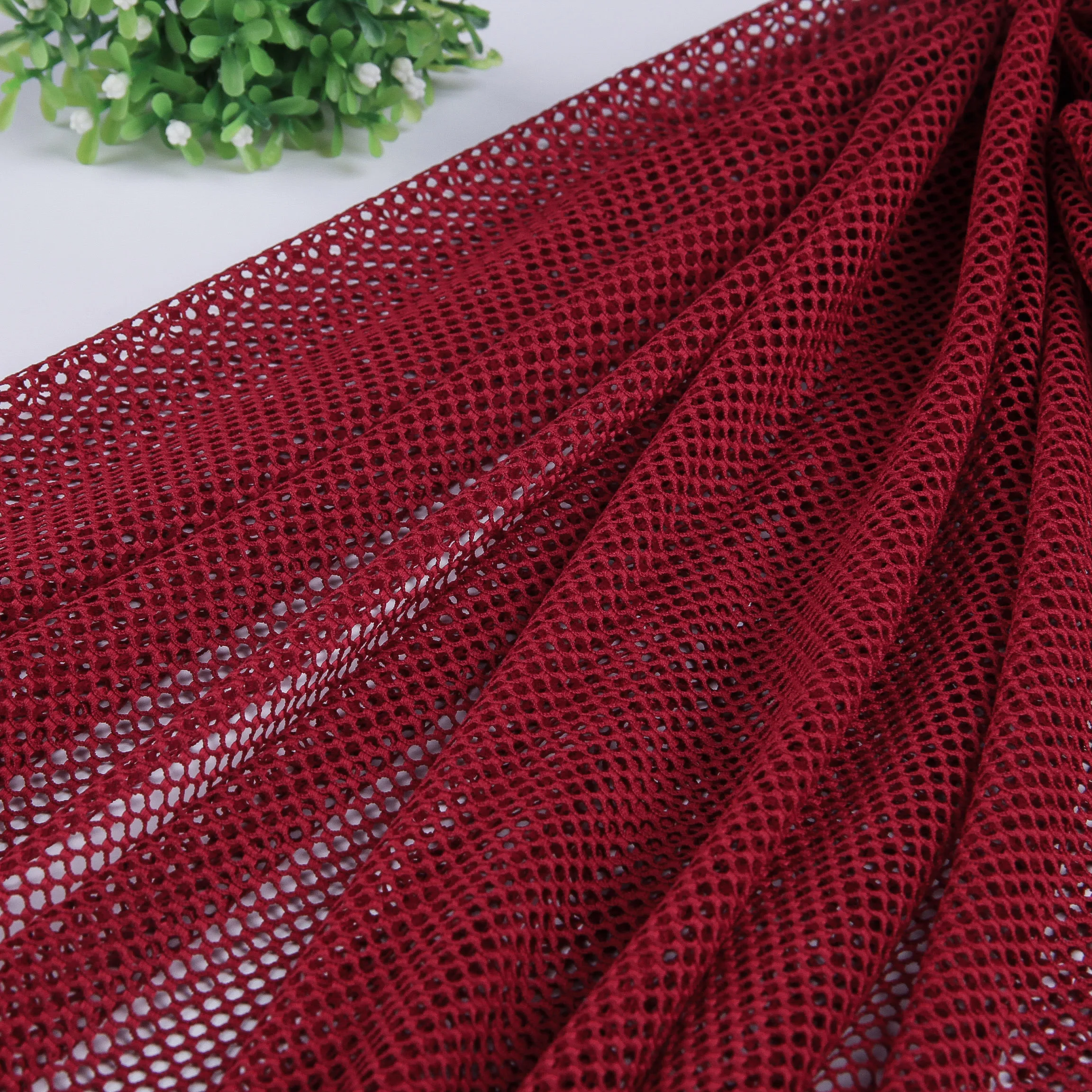 warp knitting raschel elastic polyester mesh fabric for swimsuit