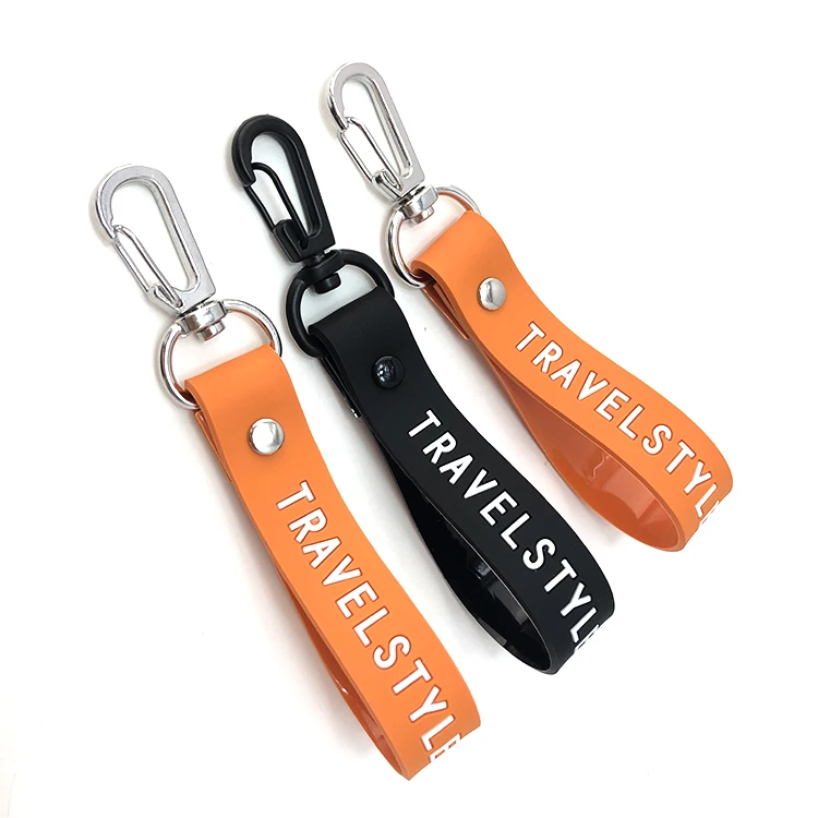 Hot sale black color tape and engraved logo 100% soft silicone wristband key chain