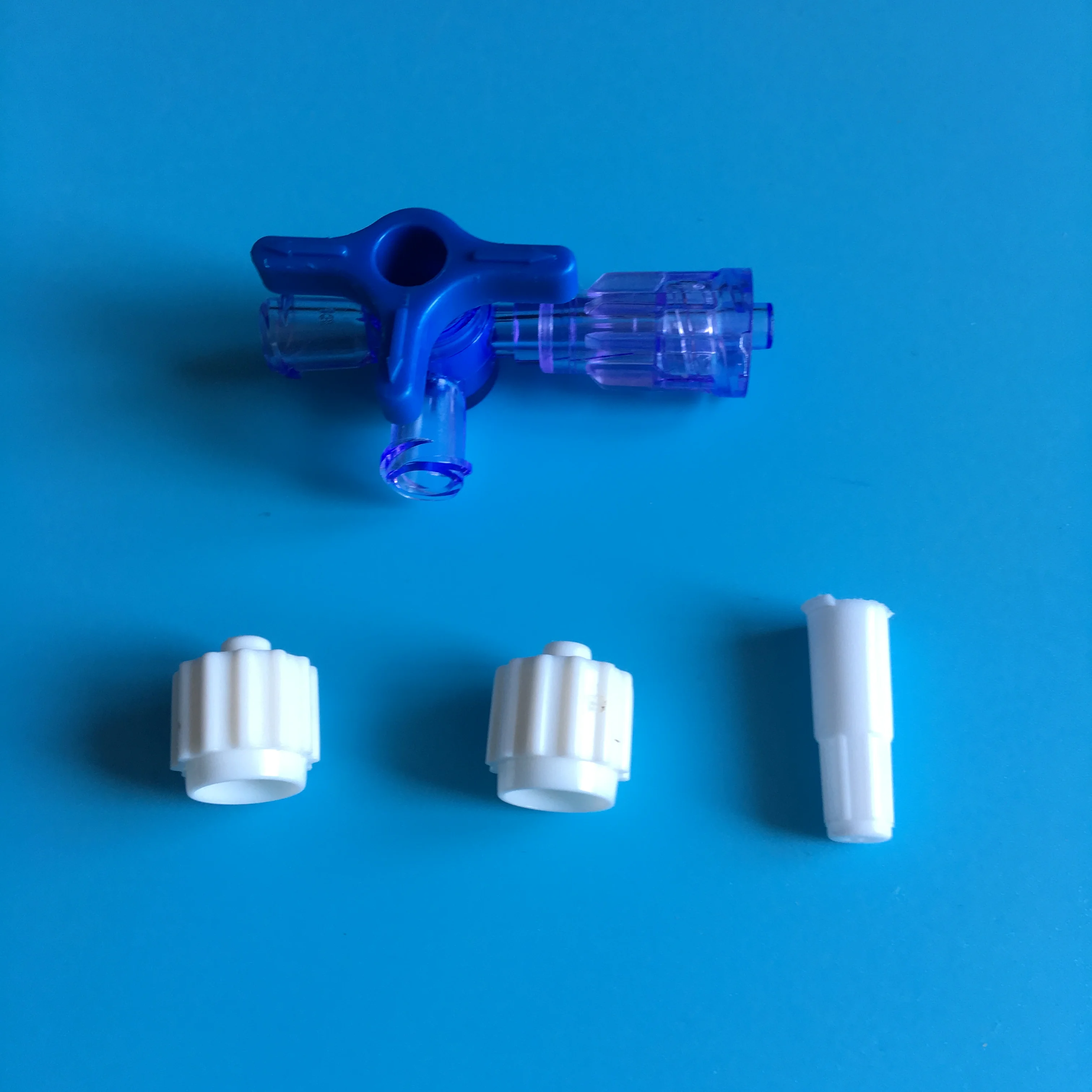 Three way stopcock with two female luer lock one male luer lock