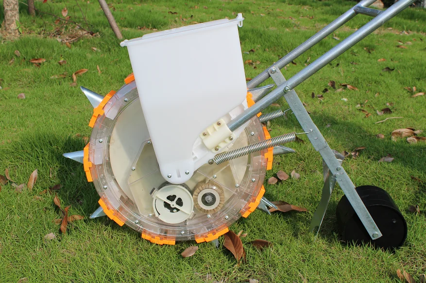 Hand-propelled household small roller seeder for planting corn, soybean, cotton and wheat