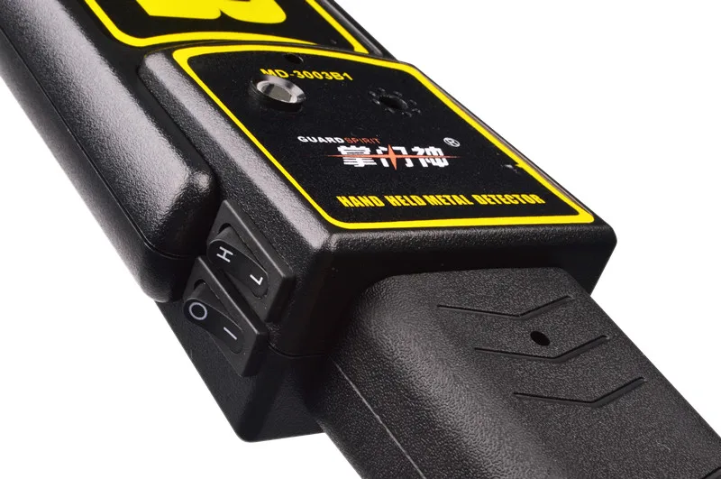 
security guard hand holding mini metal detector for public safety checking 