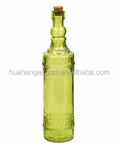Colored patterned glass bottle with cork lid