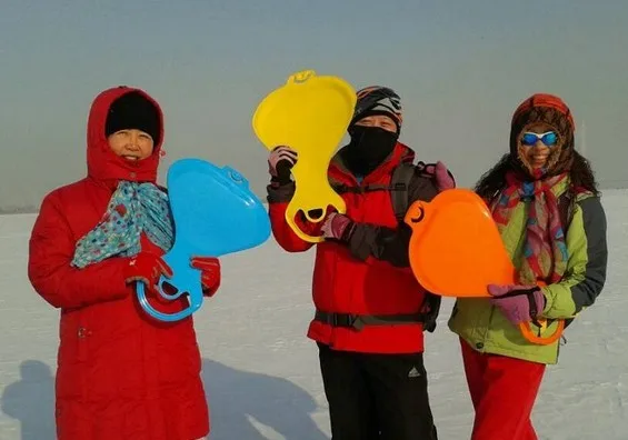 connected plastic kids adults snow slide board on grass and sand one by one