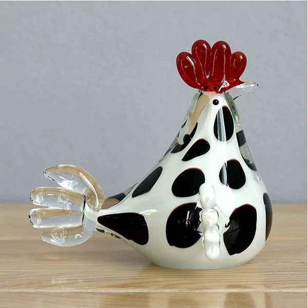 Hand made murano glass chick crafts on desk