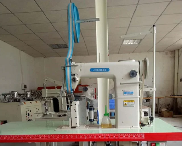 High post bed sewing machine with a folder and cutting device for sweatband