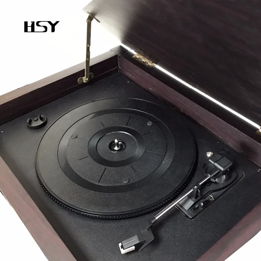 Vintage vinyl record turntable player with disc book shelf AM/FM stereo radio